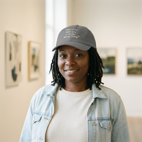 Grey cap, fuller-build Black woman in cream and pale denim